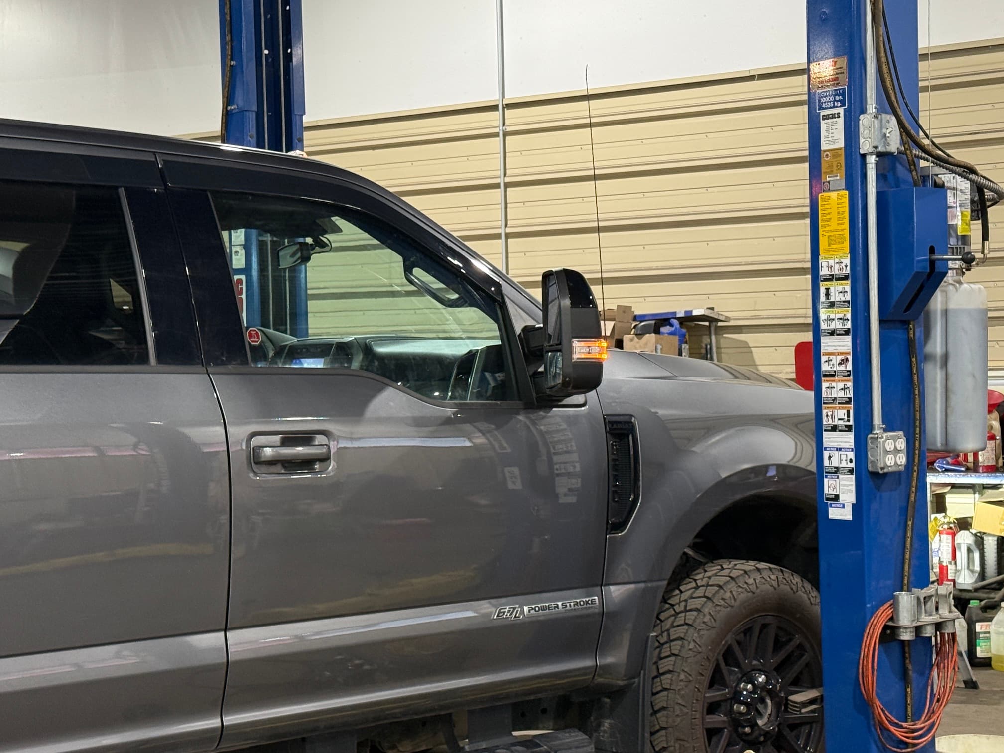 Technician working on a Ford Power Stroke diesel engine at Odessa Auto & Truck Repair