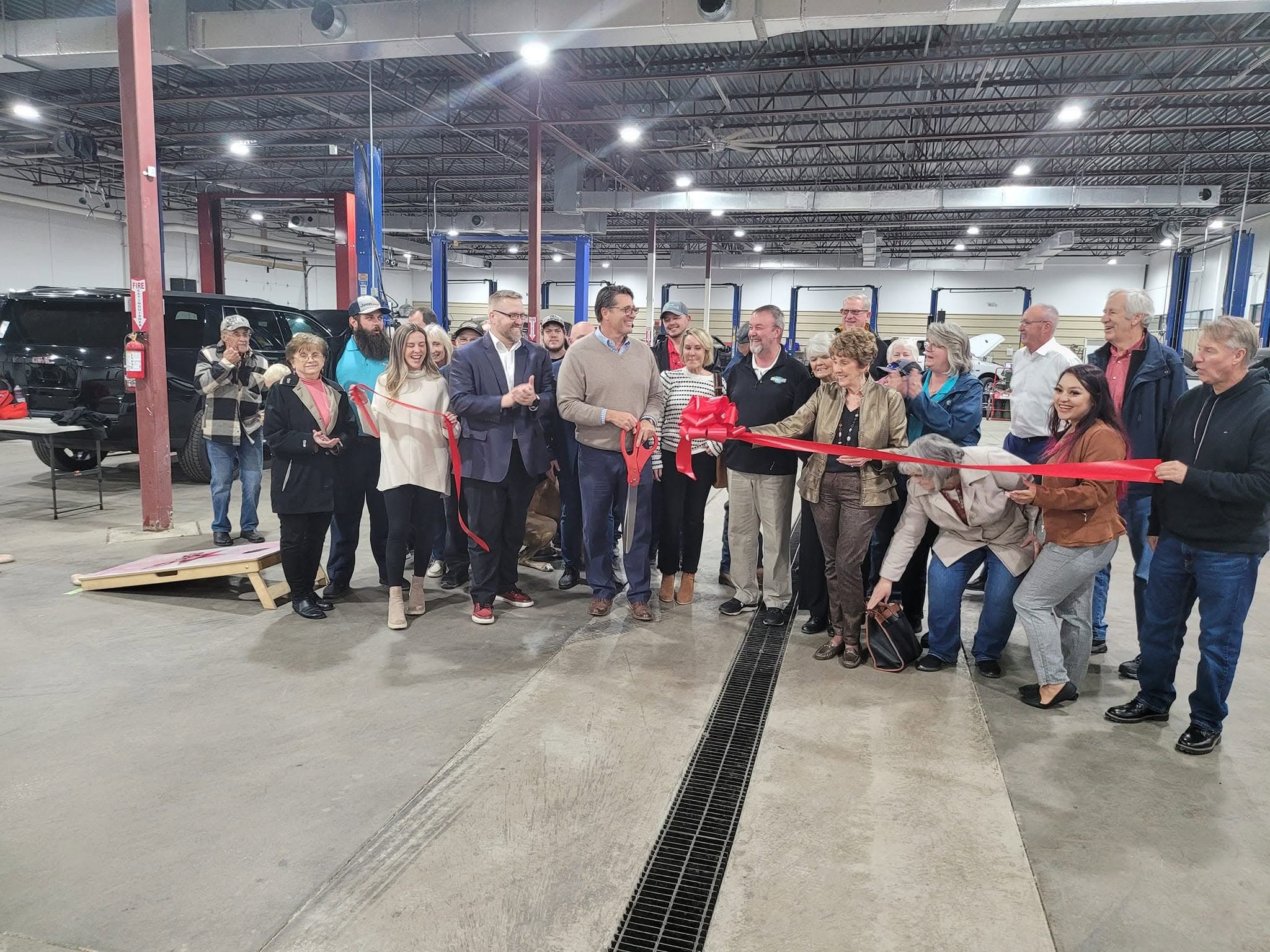 The Odessa Auto & Truck Repair crew gathered for the grand-opening ribbon-cutting